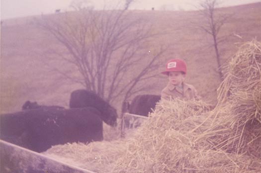 James helping feed square bales on Christmas Eve